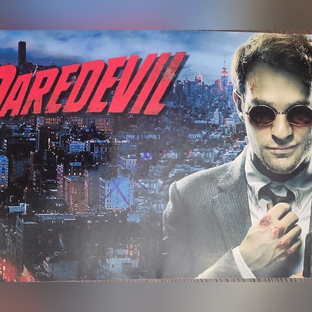 Daredevil Poster with Red Logo and Cityscape